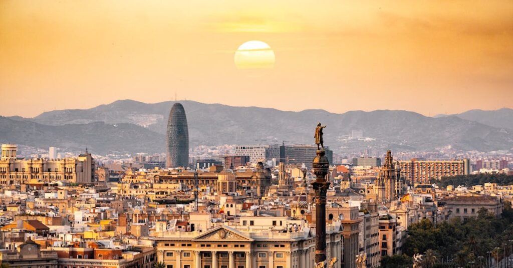 a stunning sunset view of the barcelona skyline showcasing iconic landmarks and a warm golden hour